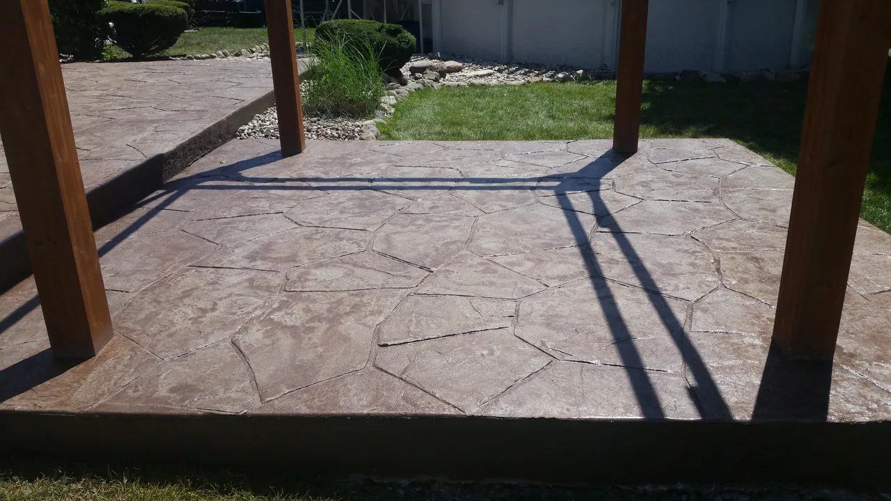 Stamped concrete patio under a pergola