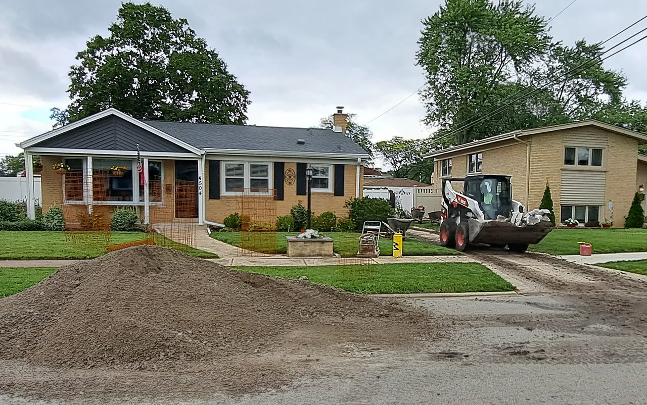 Site prep with a skid-steer moving dirt