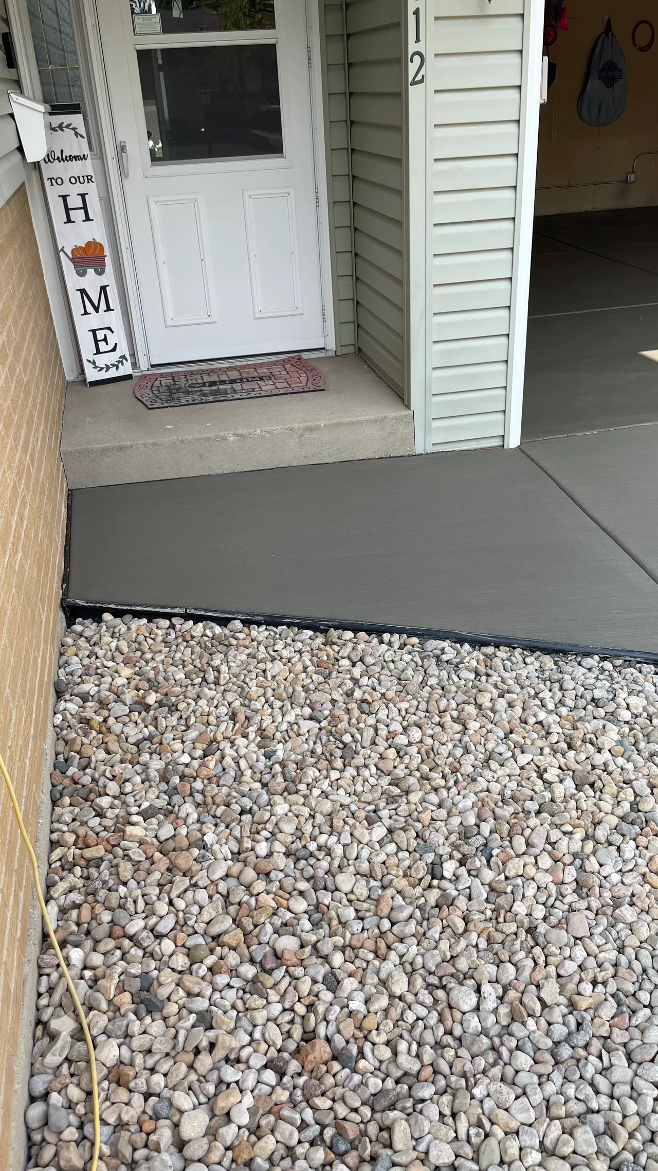 Fresh concrete pad over compacted gravel